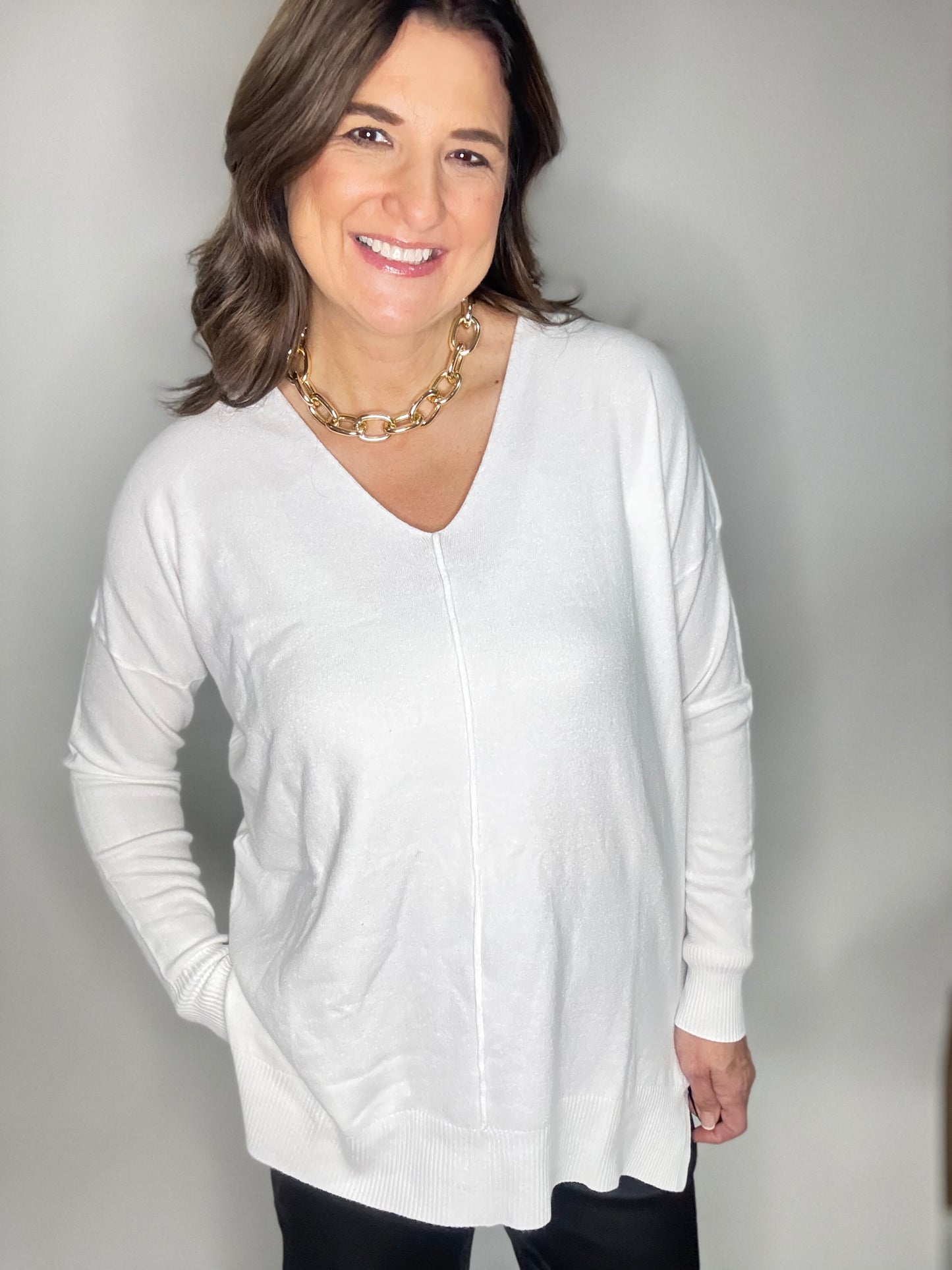 The White V-Neck Sweater