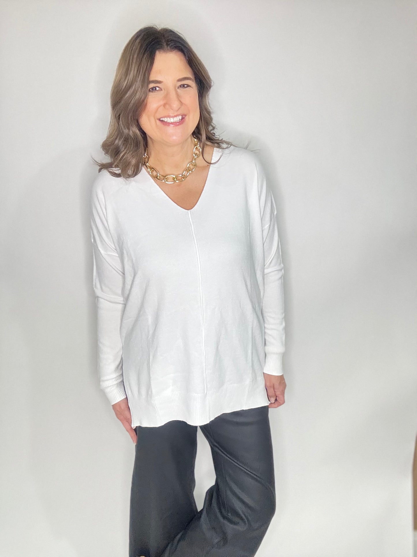 The White V-Neck Sweater