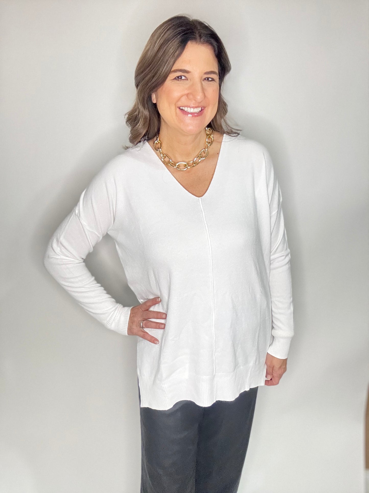 The White V-Neck Sweater